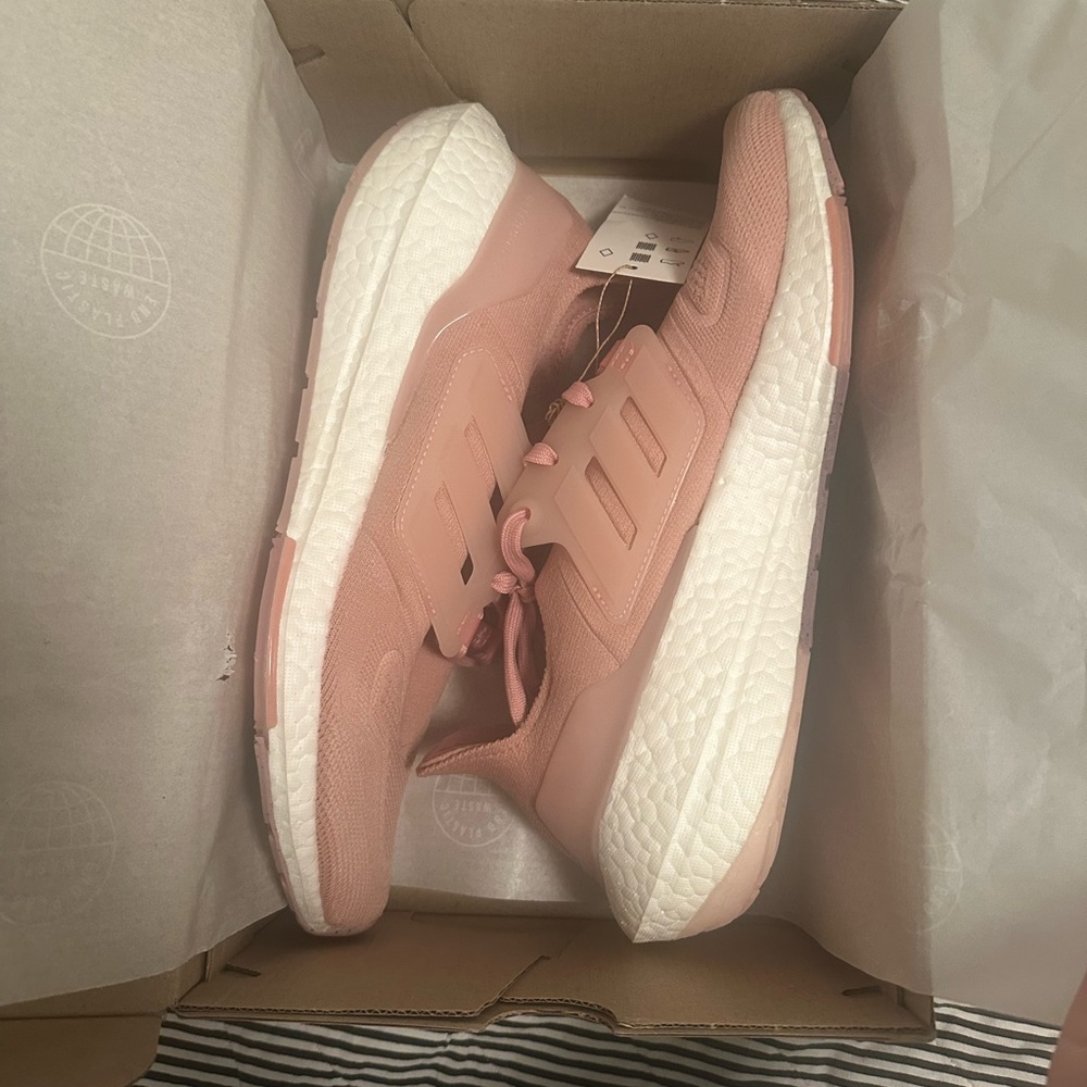 Brand new. Still in box. Pink ultraboost size 9.